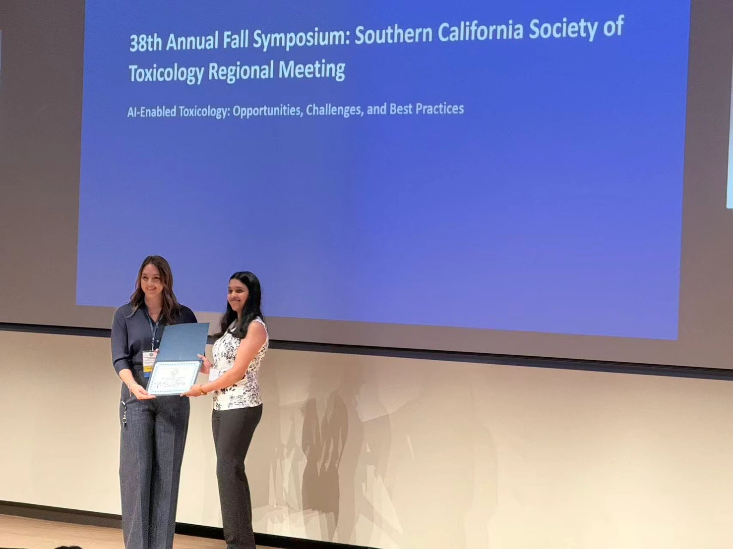 Harshitha Nandula receives an Undergraduate Student Poster Presentation Award.
